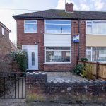 Brick terrace house with a large front bay window, white door, and a 'Rent a Room' sign on the wall.