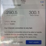 Phone screen showing internet speed test: download 290.5 Mbps, upload 300.1 Mbps, latency 46 ms, server Dublin; very fast.